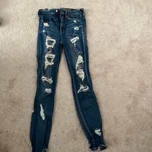 American Eagle jeans with rips in front and back